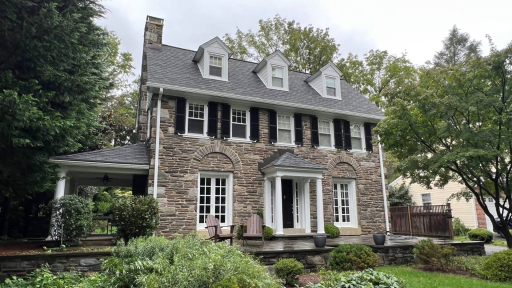Old Stone Colonial Home in Media, PA with new roofing and siding by Porter Family Exteriors