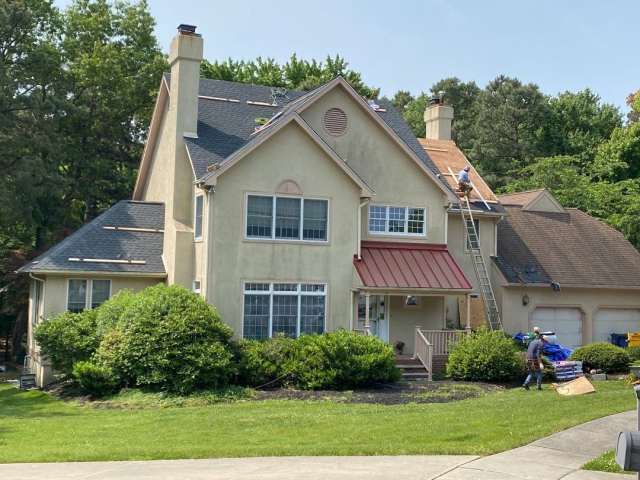 A Voorhees, NJ home undergoing a roof replacement and closed skylight integration.