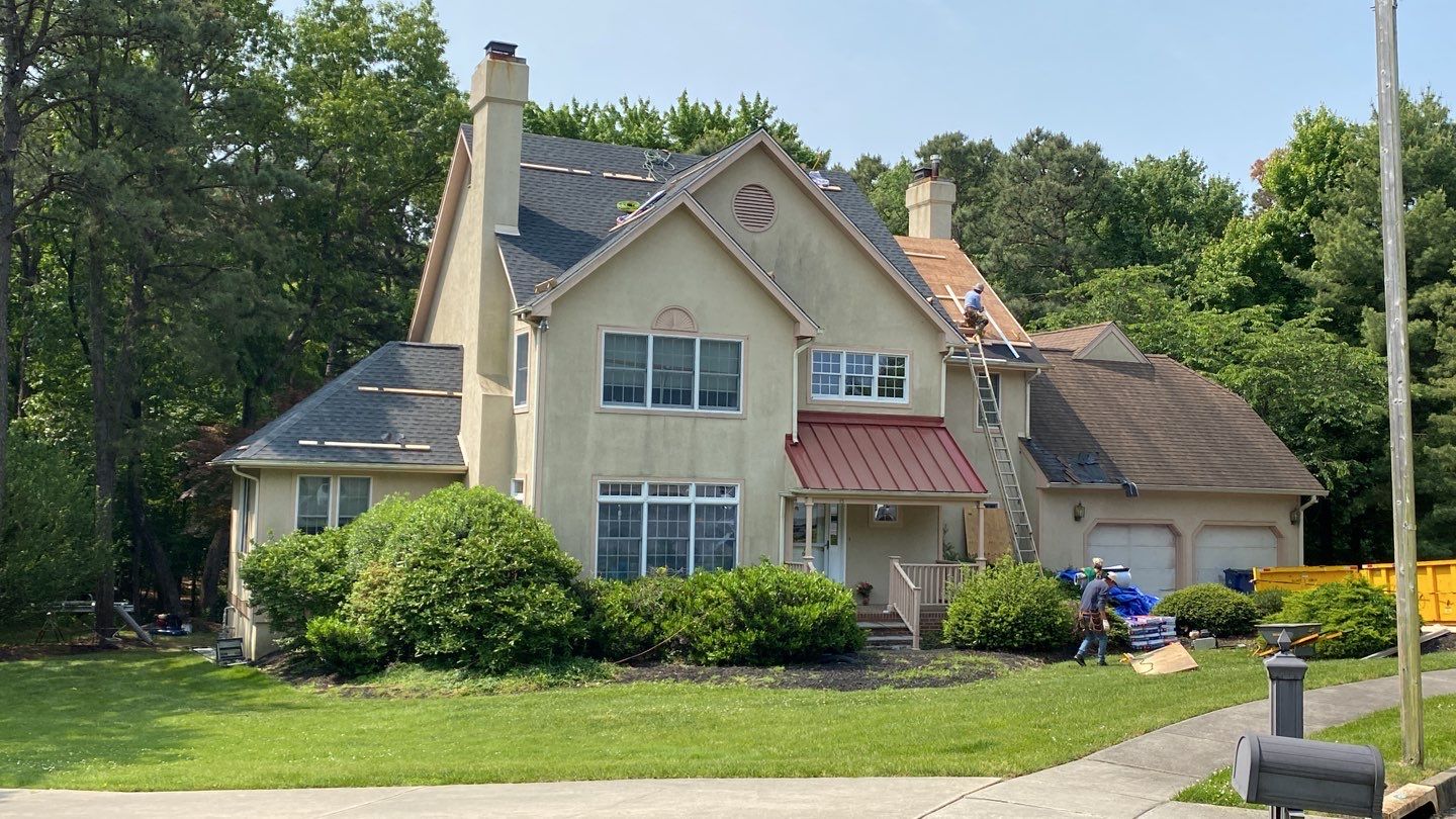 A Voorhees, NJ home undergoing a roof replacement and closed skylight integration.