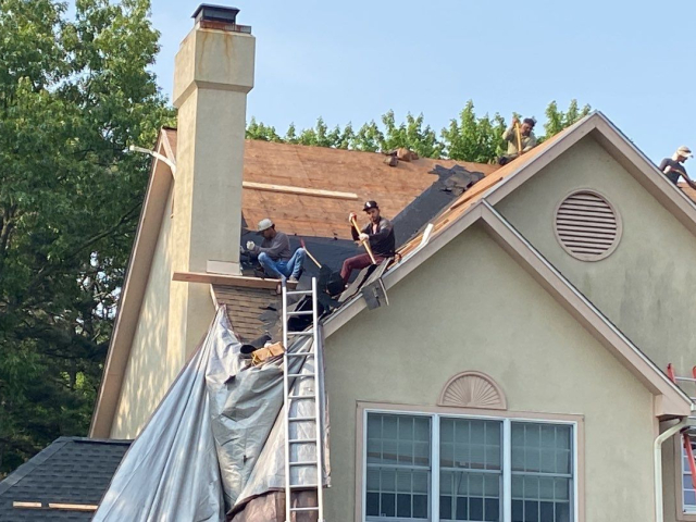 A Voorhees, NJ home undergoing a roof replacement and closed skylight integration.