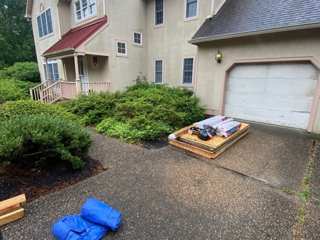 A Voorhees, NJ home undergoing a roof replacement and closed skylight integration.