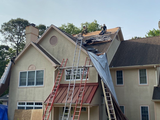 A Voorhees, NJ home undergoing a roof replacement and closed skylight integration.