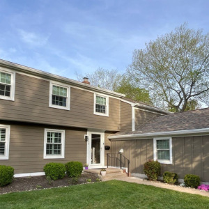 A home in New Jersey with brand new James Hardie lap siding and board and batten siding.