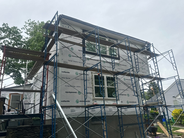 12-May-27-2025-17-59-52-swdG-1920s-tudor-hardie-siding-custom-portico Historic 1920s Tudor Being Upgraded With Hardie Siding and Custom Portico Design