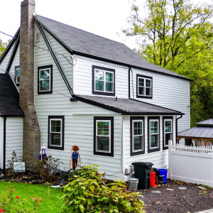 Historic 1920s Tudor Upgraded With Hardie Siding and Custom Portico Design