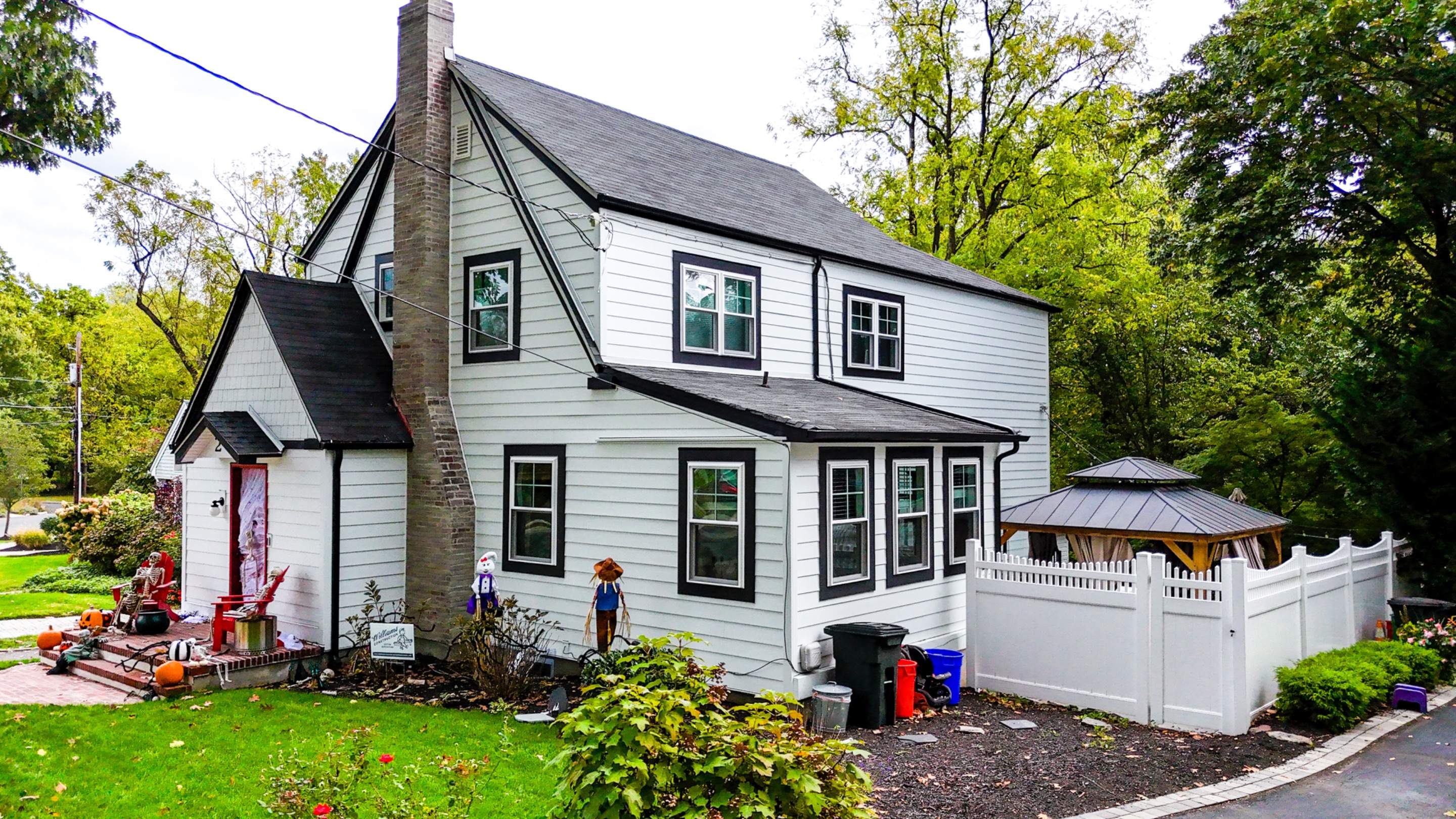 Historic 1920s Tudor Upgraded With Hardie Siding and Custom Portico Design