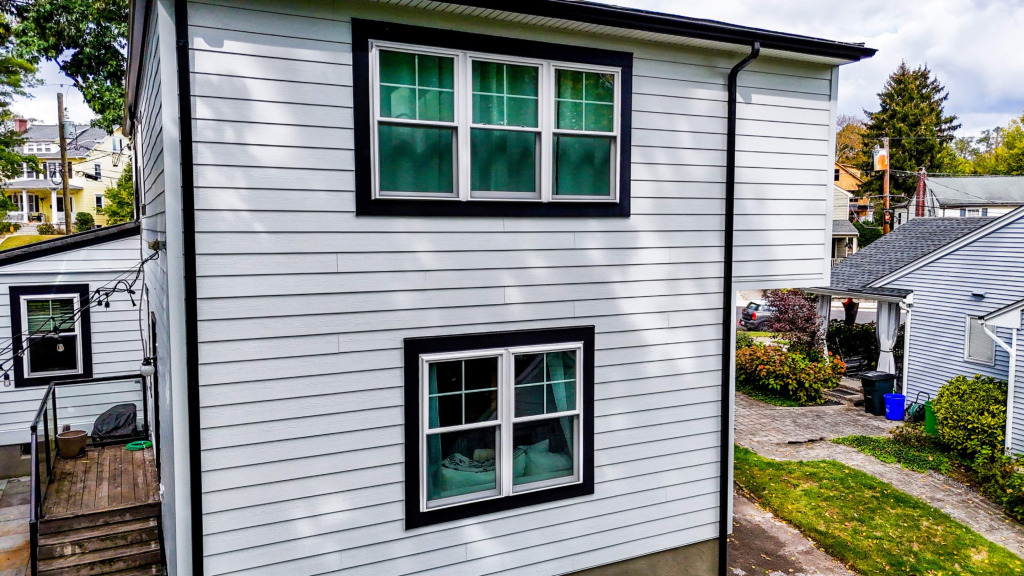 Historic 1920s Tudor Upgraded With Hardie Siding and Custom Portico Design