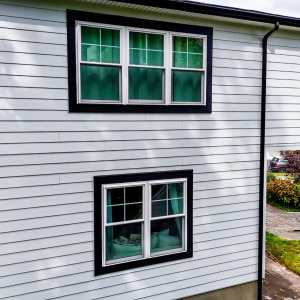 Historic 1920s Tudor Upgraded With Hardie Siding and Custom Portico Design