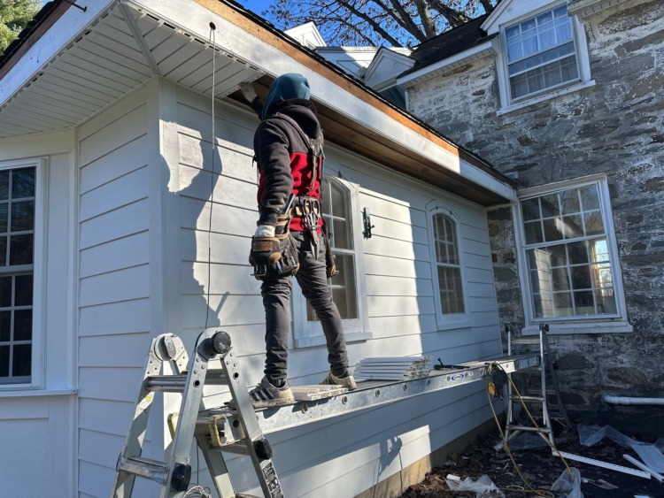 Porter Exterior Contractor installing soffit and fascia during Gladwyne PA exterior renovation with James Hardie siding