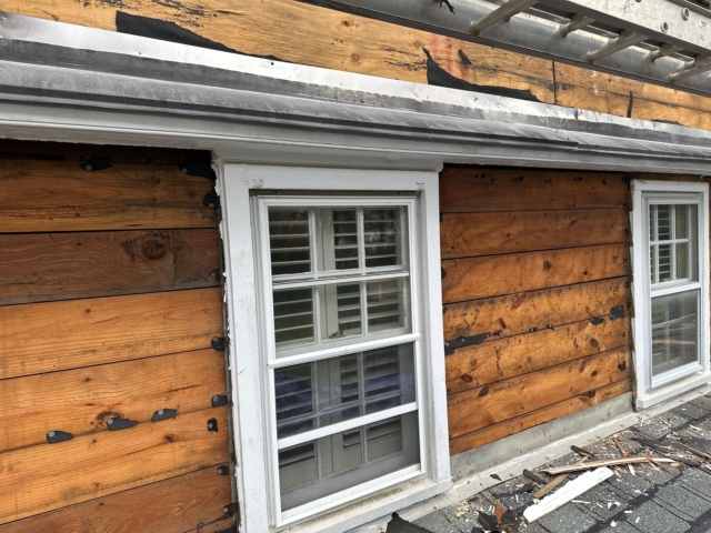 Close up of exposed wood siding and window trim during Gladwyne PA exterior siding renovation