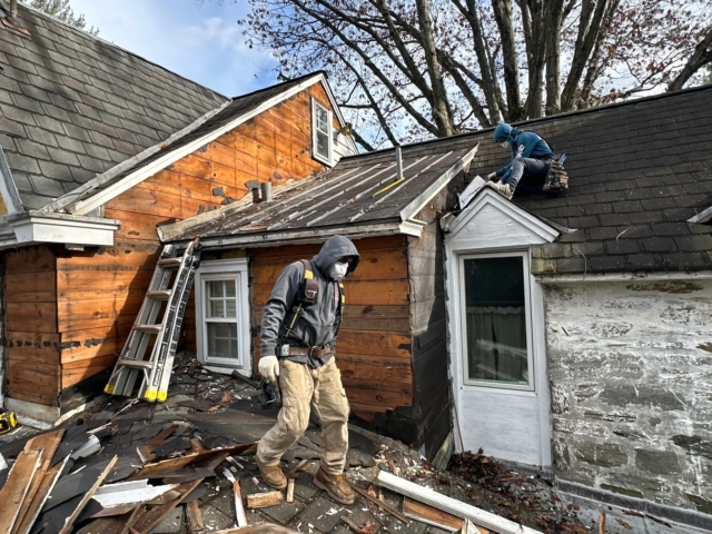 Porter Exterior Contractors removing old siding and preparing roofline areas during Gladwyne PA exterior renovation