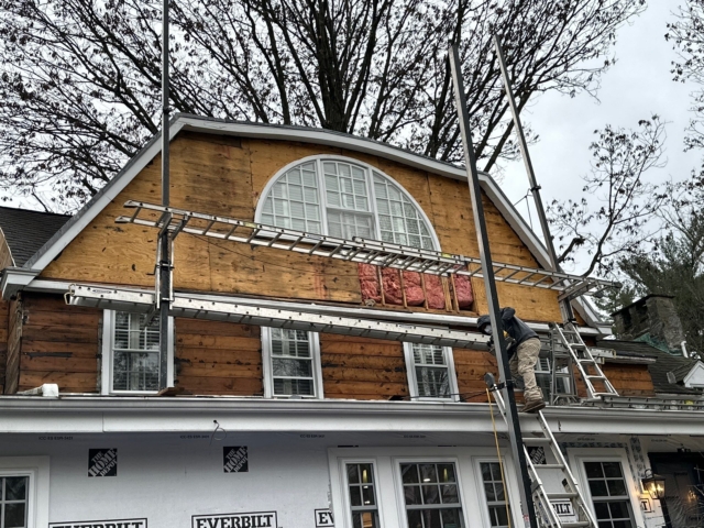 Old wood siding removed from Gladwyne PA home during exterior renovation before new siding installation