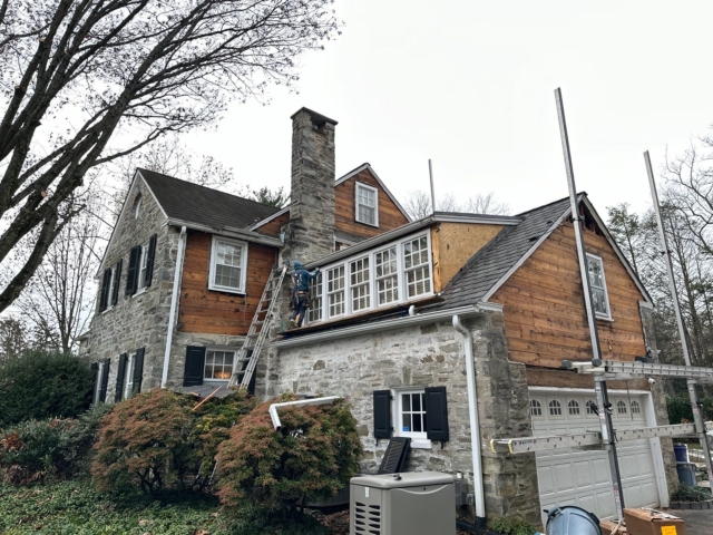 Gladwyne PA stone home with old wood siding removed during exterior renovation and siding replacement work