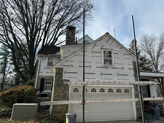 Gladwyne PA home covered with James Hardie weather barrier during siding replacement and exterior renovation