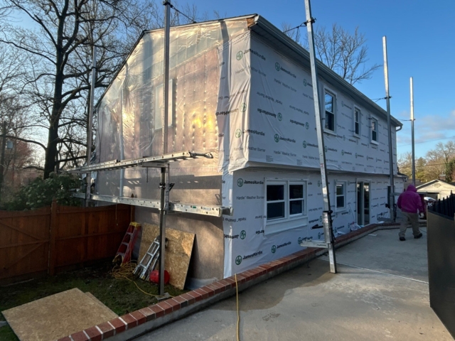 Rear and side walls of the Yardley home wrapped in James Hardie weather barrier during siding preparation by Porter Exterior. Rear and side walls of the Yardley home wrapped in James Hardie weather barrier during siding preparation by Porter Exterior.