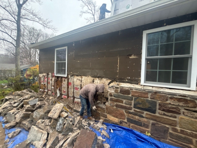 Porter Exterior removing the original stone exterior during the Yardley, PA James Hardie siding transformation by Porter Exterior. Porter Exterior removing the original stone exterior during the Yardley, PA James Hardie siding transformation by Porter Exterior.