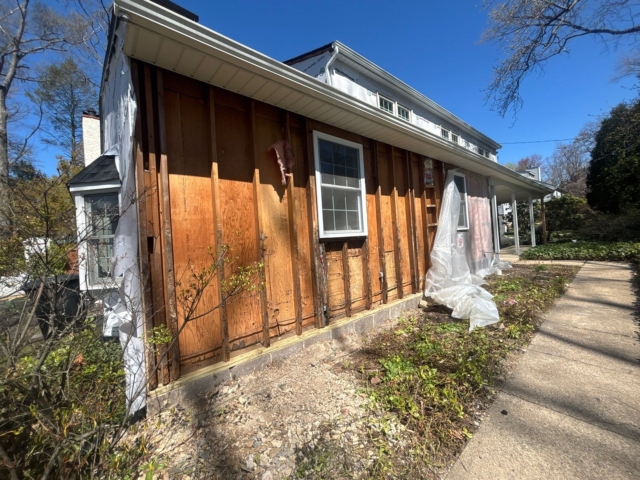 Exposed wall framing and plywood sheathing during exterior rebuilding before James Hardie siding installation in Yardley, PA. Exposed wall framing and plywood sheathing during exterior rebuilding before James Hardie siding installation in Yardley, PA.