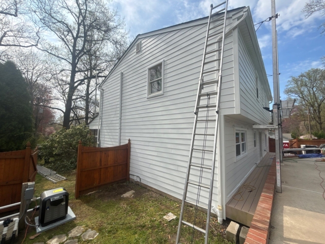Side gable of the Yardley, PA home finished with Arctic White James Hardie siding, trim, soffit, and corner boards. Side gable of the Yardley, PA home finished with Arctic White James Hardie siding, trim, soffit, and corner boards.