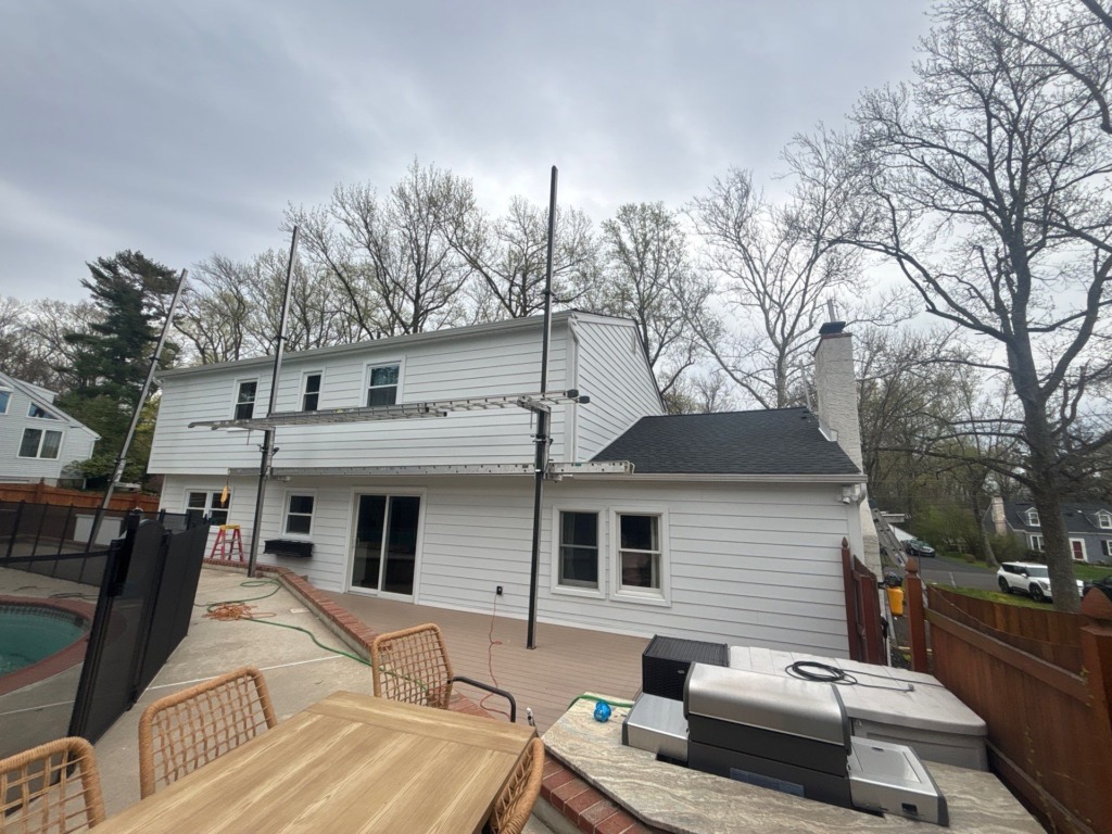 Rear of the Yardley home finished with white James Hardie lap siding, white trim, and updated exterior details by Porter Exterior.
