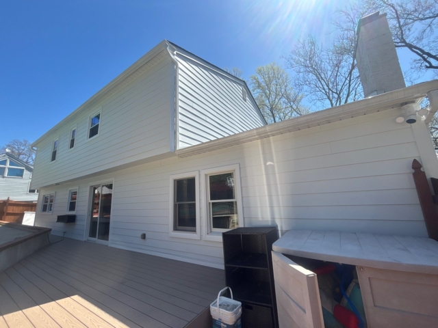 Completed rear exterior transformation in Yardley, PA featuring white James Hardie lap siding, trim, and updated soffit. Completed rear exterior transformation in Yardley, PA featuring white James Hardie lap siding, trim, and updated soffit.