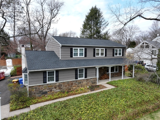 Aerial front view of the Yardley, PA home before its James Hardie siding transformation. Aerial front view of the Yardley, PA home before its James Hardie siding transformation by Porter Exterior.
