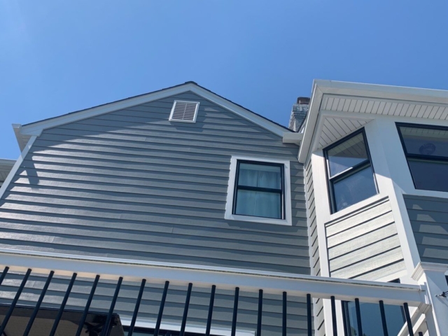 Gray Slate James Hardie siding, black windows, and white trim installed by Porter Family Exteriors