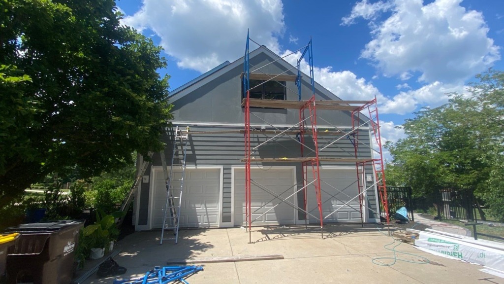Porter Family Exteriors completing James Hardie siding installation around a three-car garage in Blue Bell