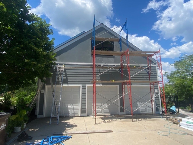 Porter Family Exteriors completing James Hardie siding installation around a three-car garage in Blue Bell