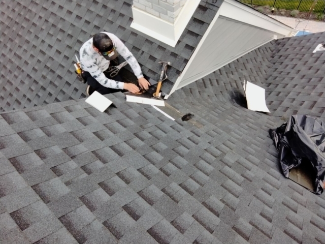 Porter Family Exteriors roofer installing flashing at a roof and gable intersection in Blue Bell, PA