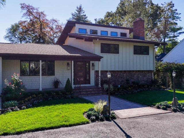 Completed Medford NJ exterior renovation with siding, stone and updated windows