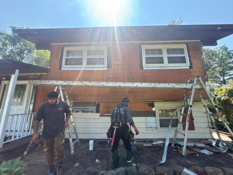 Existing siding removal during Medford NJ front exterior renovation