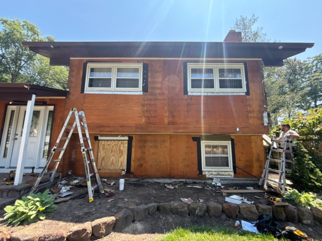 Exposed wall sheathing after siding removal on Medford NJ home