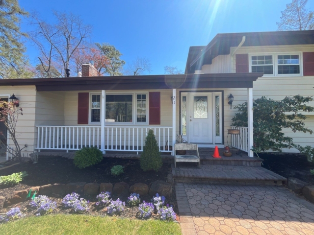 Front entry and original siding before exterior renovation in Medford NJ