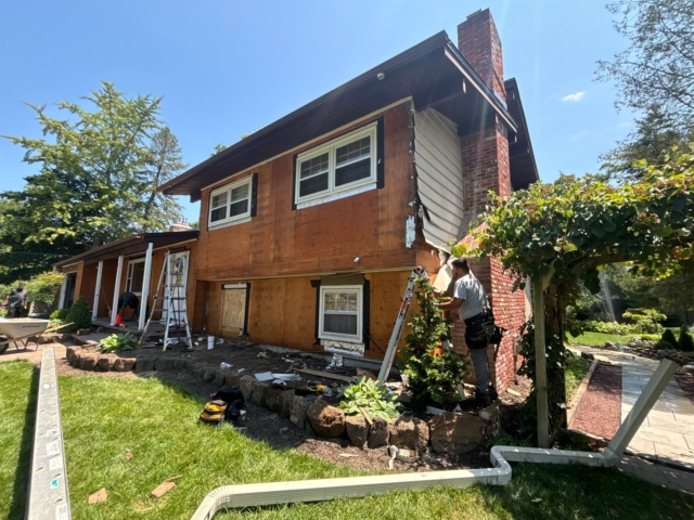 Siding removal and exposed sheathing during Medford NJ exterior renovation