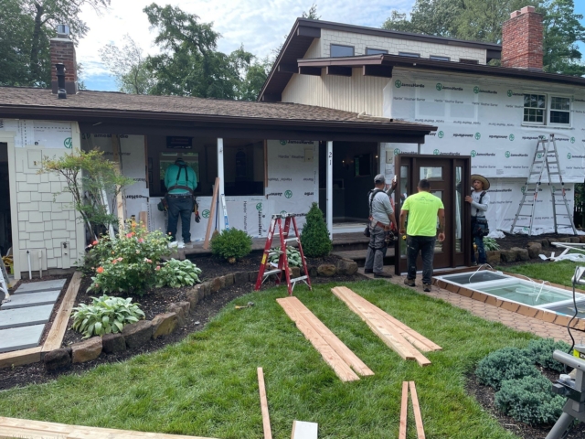 Window installation work during James Hardie exterior renovation in Medford NJ